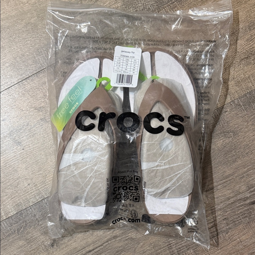 CROCS Women's Brown and White Flip Sandals with Green Accent